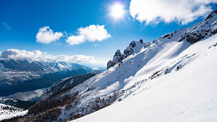 Sun over an open snow bowl at Cerro Catedral