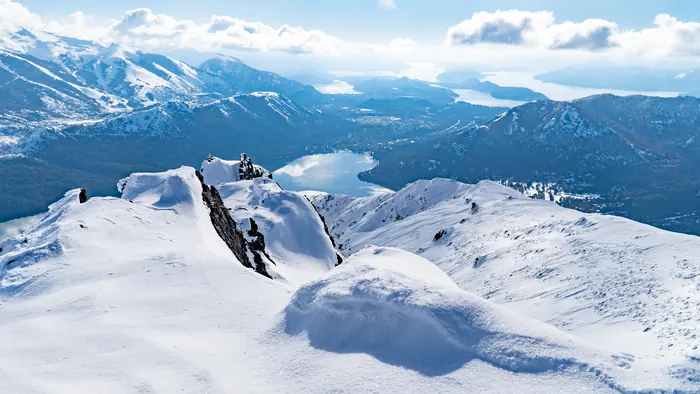 Snow-covered ridgeline above Nahuel Huapi lake