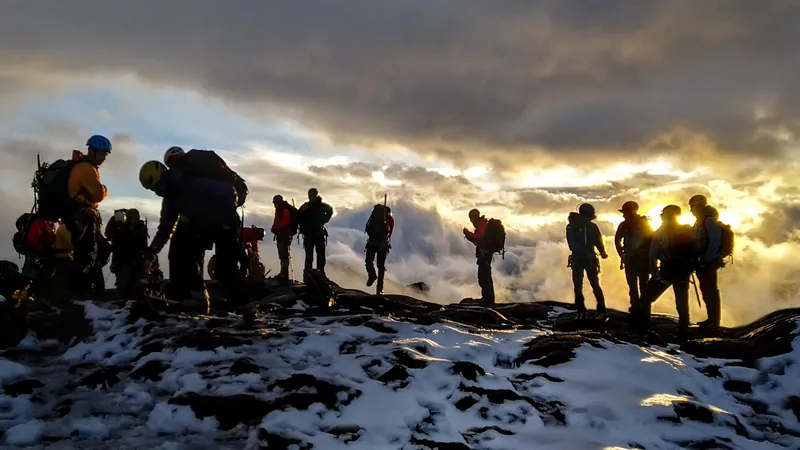 A small group on a ridge above the clouds at first light, Bariloche